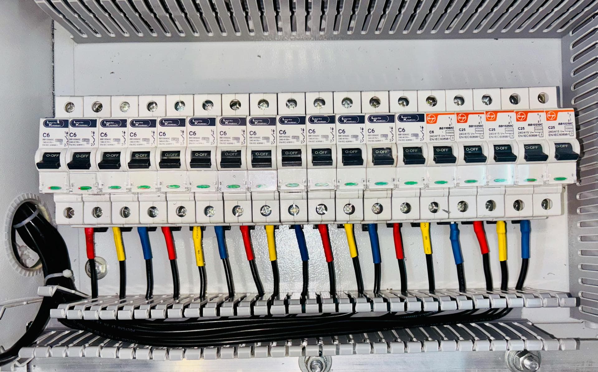 Electrician working a breaker panel
